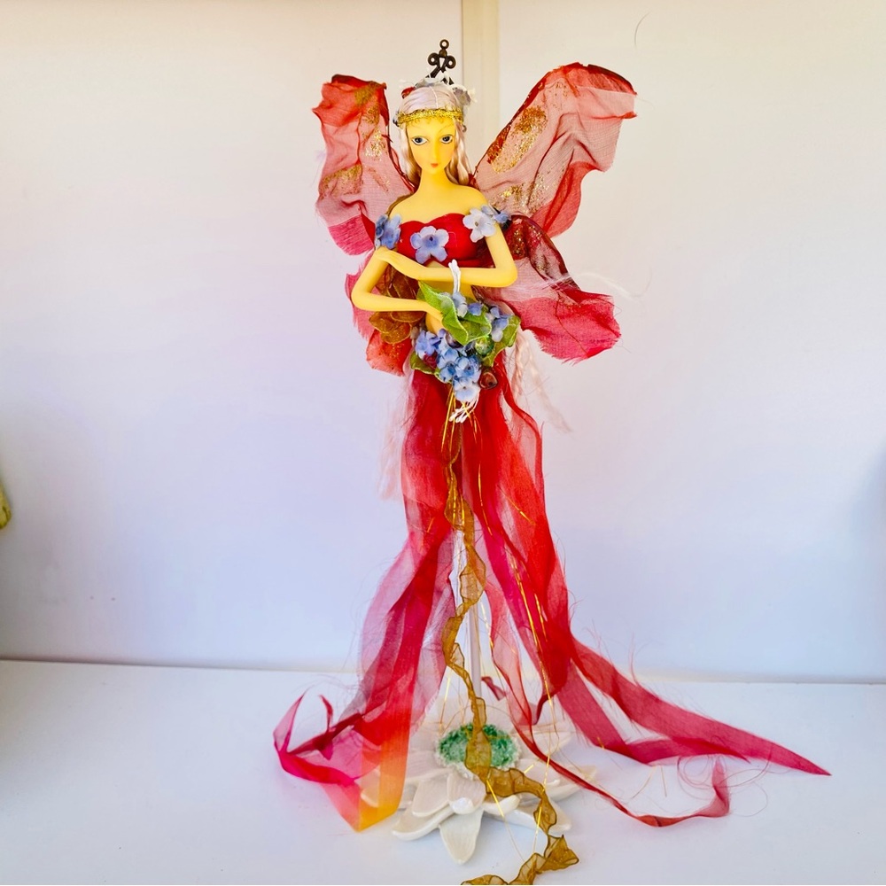 Red and Gold Fairy Figurine with Flowers